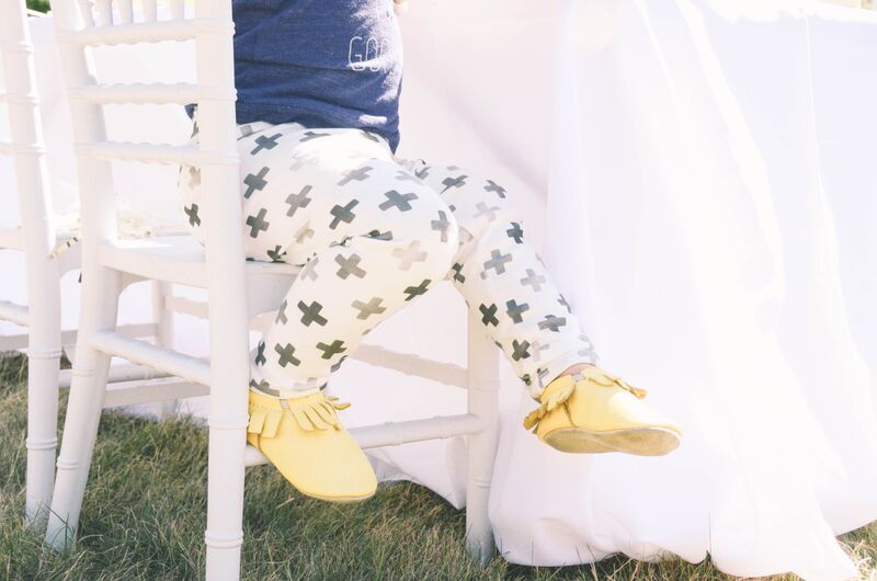 chiavari rental chairs by chic fete with girl in kewe clothing, emerson apparel and mini mocs