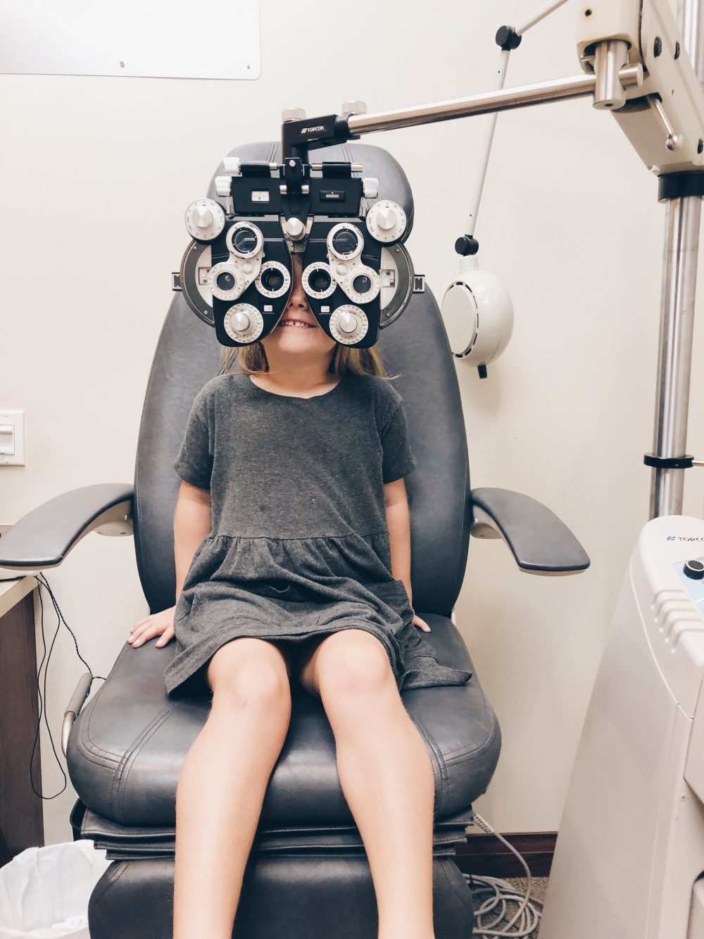 Getting her eyes tested before going back to school